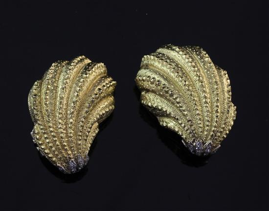 A pair of Cartier 18ct gold and diamond set shell shaped ear clips, 1.5in.